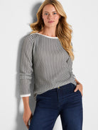 A regular-fit black and white vertical pattern knit sweater with contrast white boat neck and trimmed cuffs.