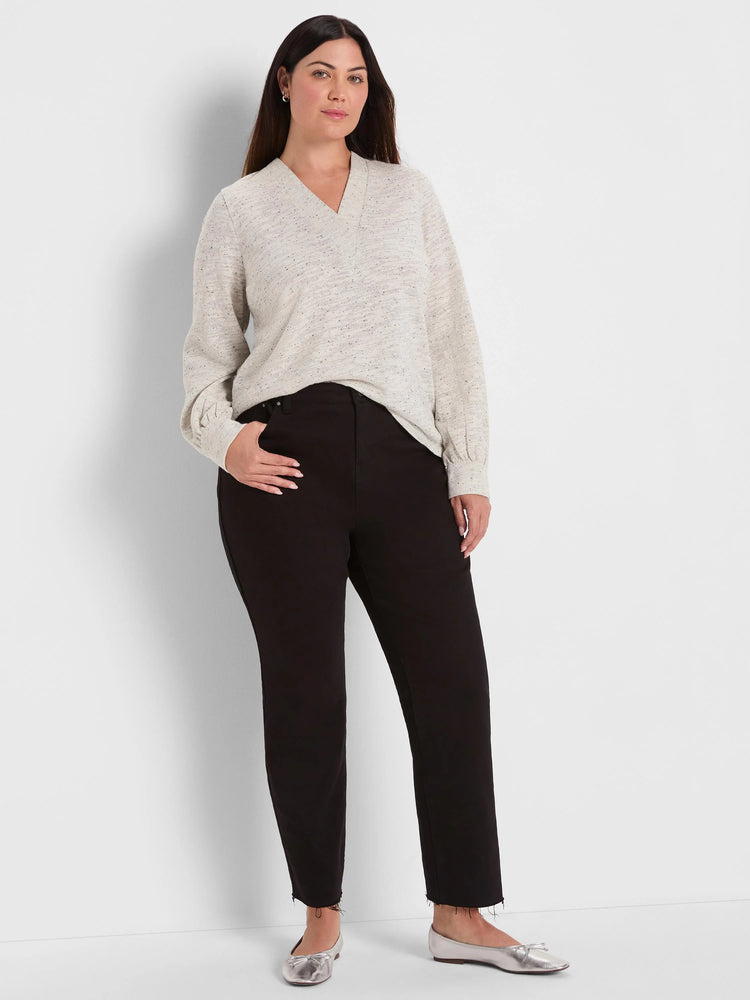 Light beige V-neck nep knit top with dark flecks, long sleeves, and a relaxed fit.