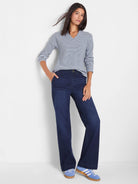 Light blue thermal knit top with thin navy horizontal stripes, long sleeves, and a V-neck.