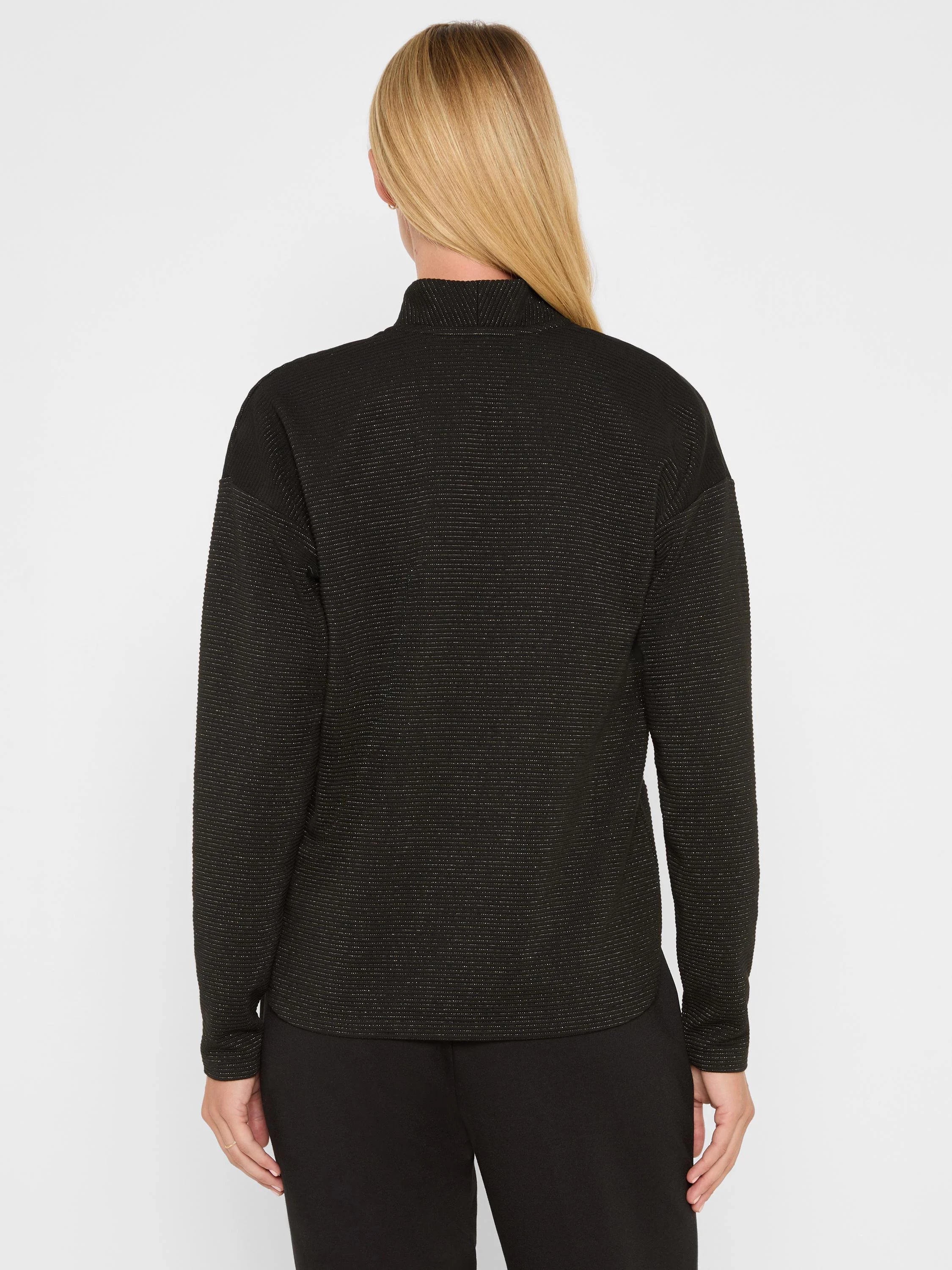 Black long-sleeve mock neck top with fine horizontal sparkle stripes. Back view.