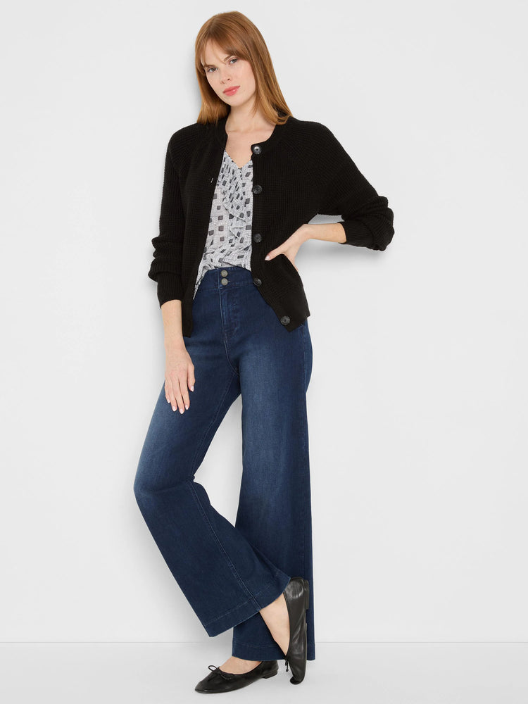 Black waffle knit, hip-length cardigan with a round neckline and front buttons.