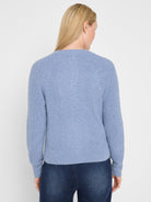Light blue waffle-knit cardigan, back view. Features raglan sleeves, ribbed cuffs, and hem.