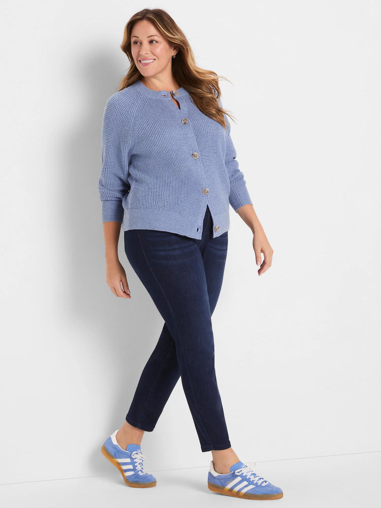 Periwinkle waffle knit cardigan featuring a button-front closure with light brown buttons and ribbed cuffs.