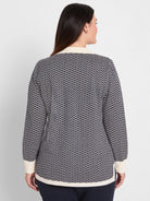 Two-tone navy & cream jacquard sweater with an interlocking zig-zag pattern. Cream collar, cuffs, hem.