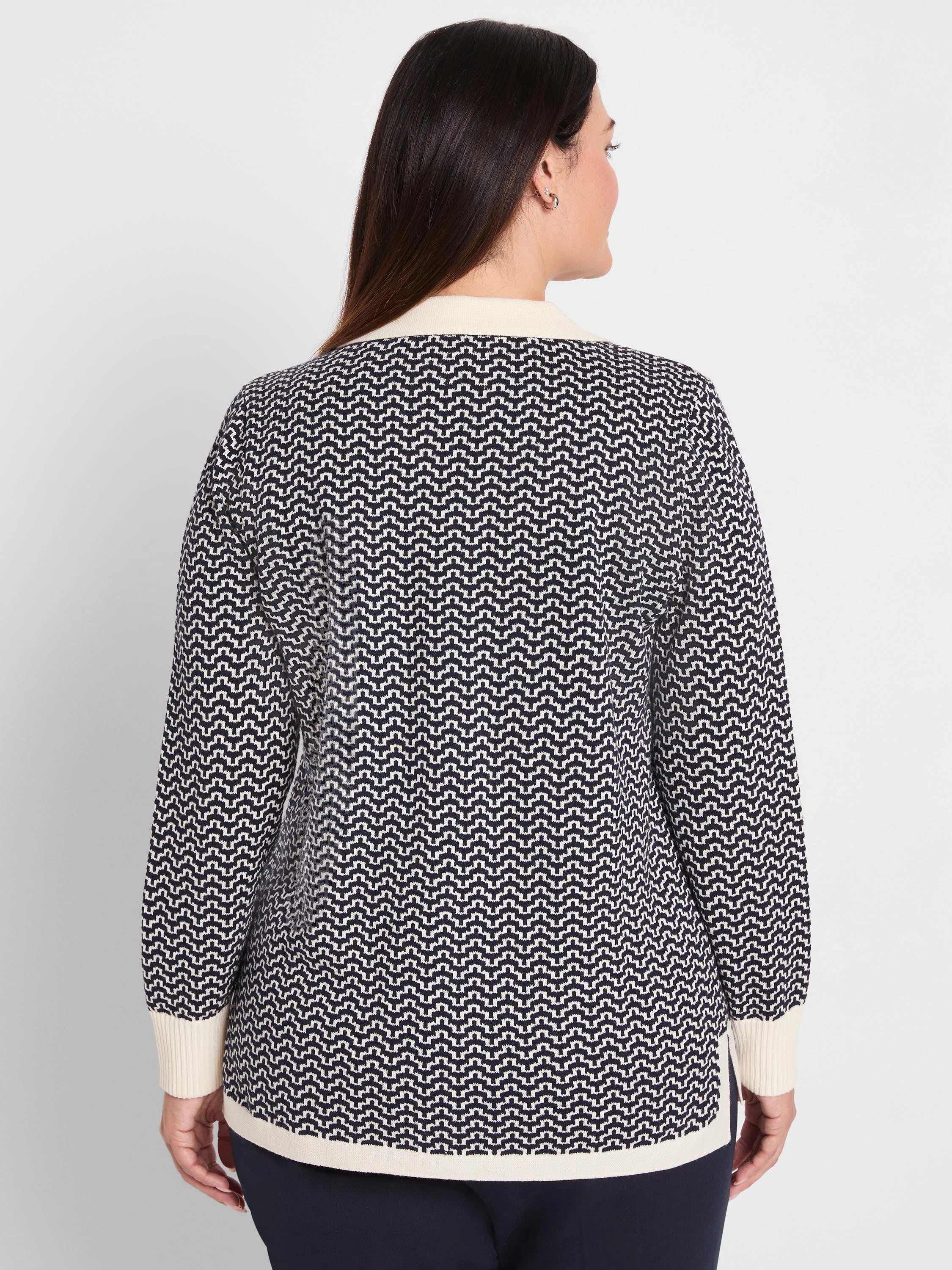 Two-tone navy & cream jacquard sweater with an interlocking zig-zag pattern. Cream collar, cuffs, hem.