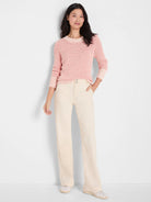 Light pink variegated chunky knit sweater with long sleeves and a crew neck.