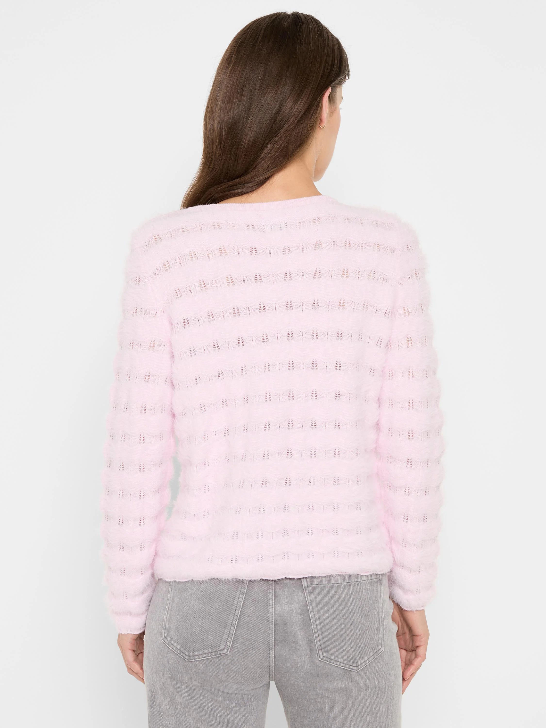 Light pink fuzzy sweater, back view, with alternating horizontal stripes of solid knit and open wavy pattern.