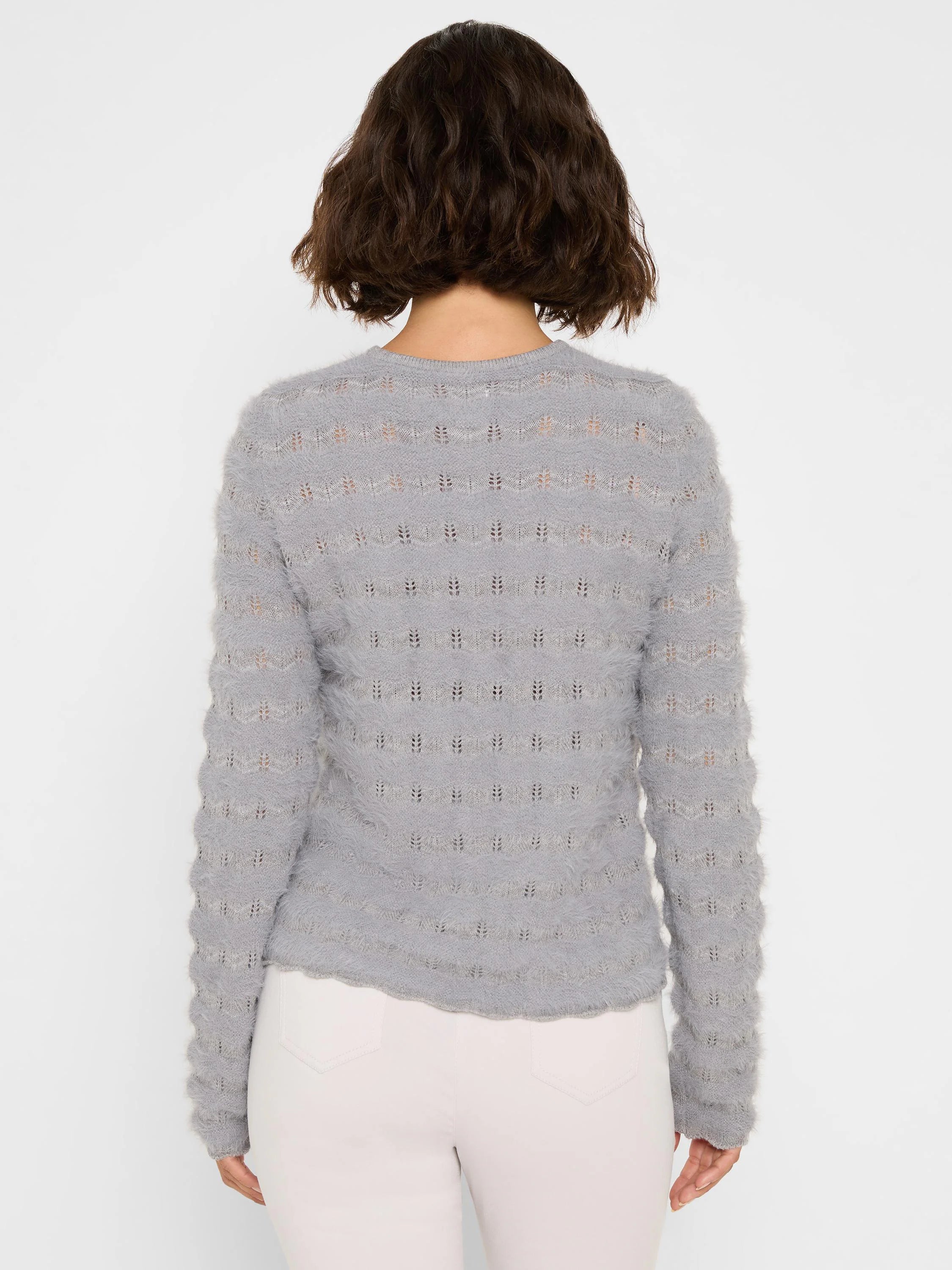 Grey fuzzy knit sweater, back view, with horizontal rows of wavy open-knit eyelets.