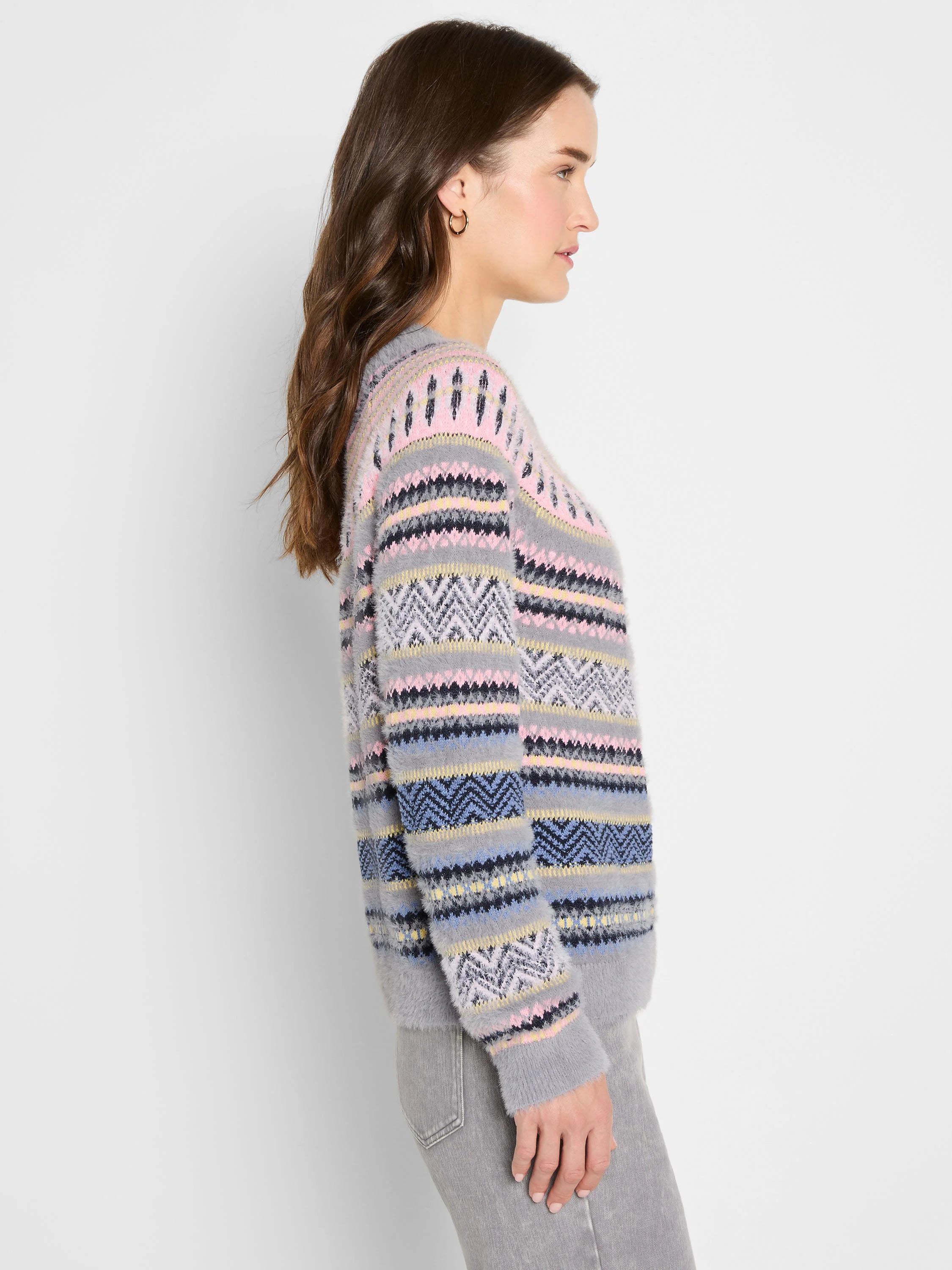 Fuzzy grey Fairisle sweater with pink, black, light blue, and yellow geometric patterns.