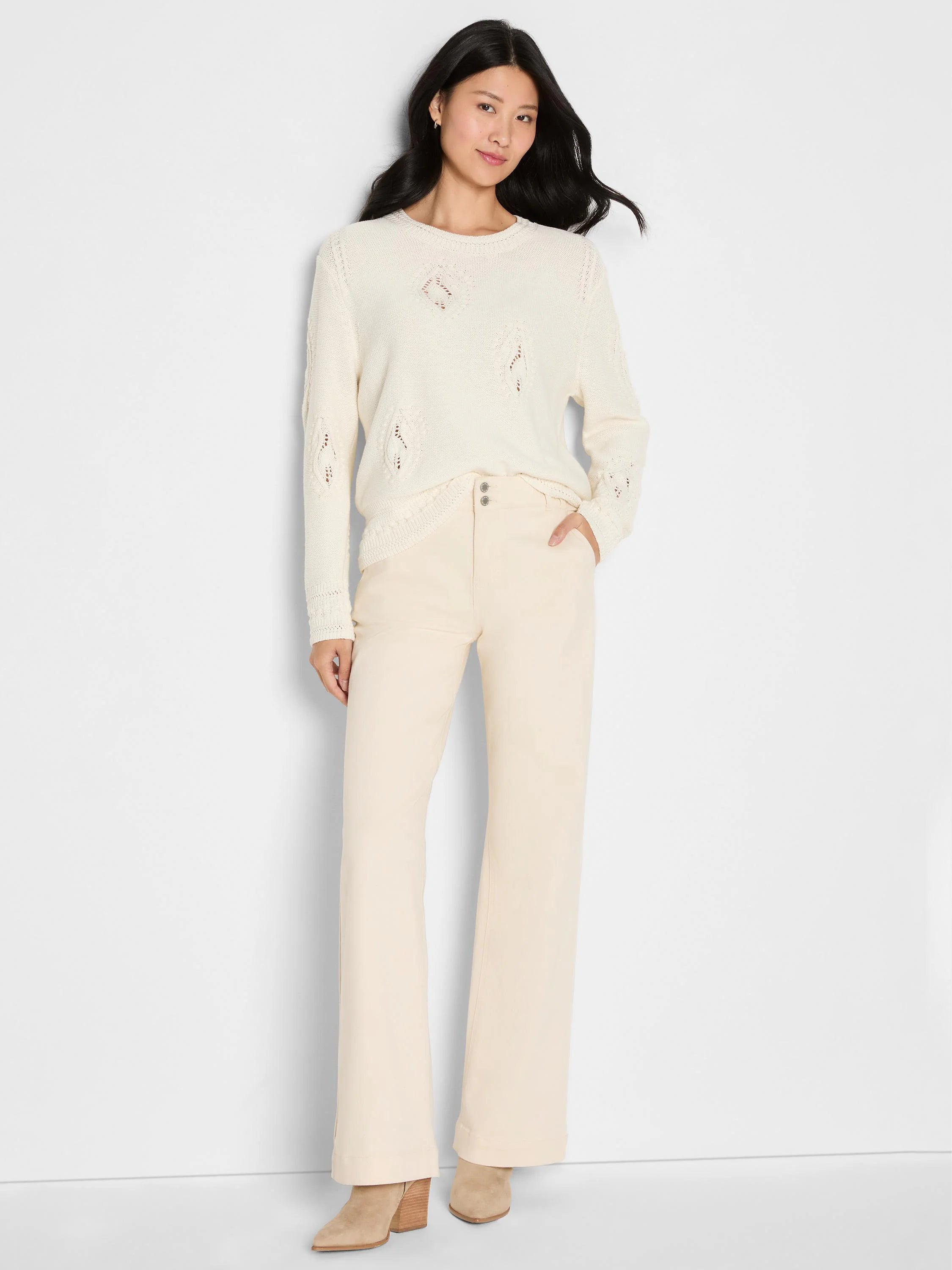 Cream long-sleeve sweater featuring an open-knit paisley dot pattern throughout.