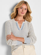 Cream tuck texture sweater with blue flecks. Split V-neck and cuffs feature blue & cream stripes.