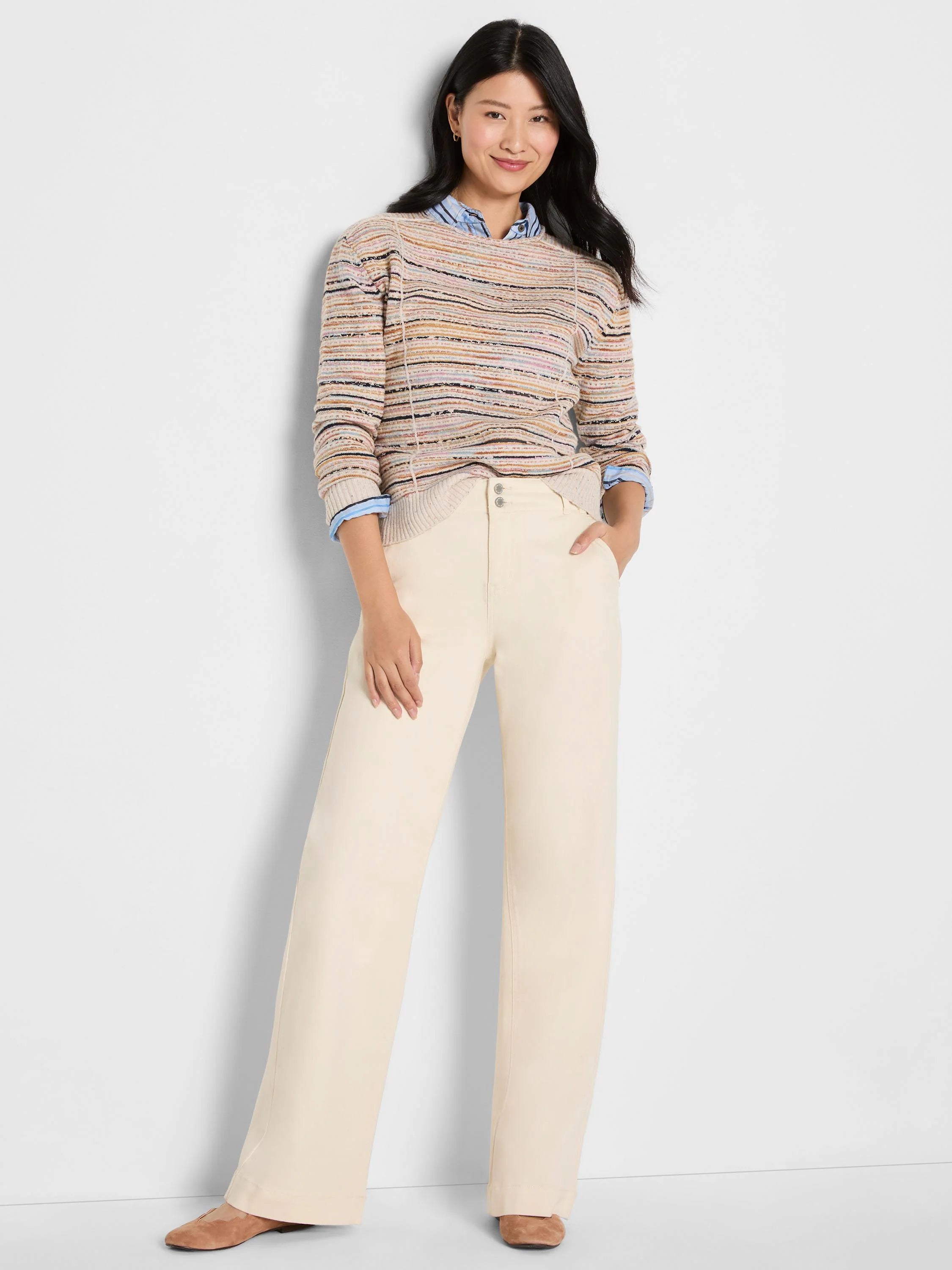 Cream knit sweater with narrow horizontal stripes in pink, blue, black, and tan. Features subtle vertical seams.