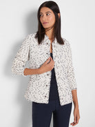 Cream & black nep weave jacket with fringe edges, collarless, and silver snaps. 3/4 sleeves.