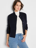 Navy knit bomber jacket with a ribbed collar and button front.