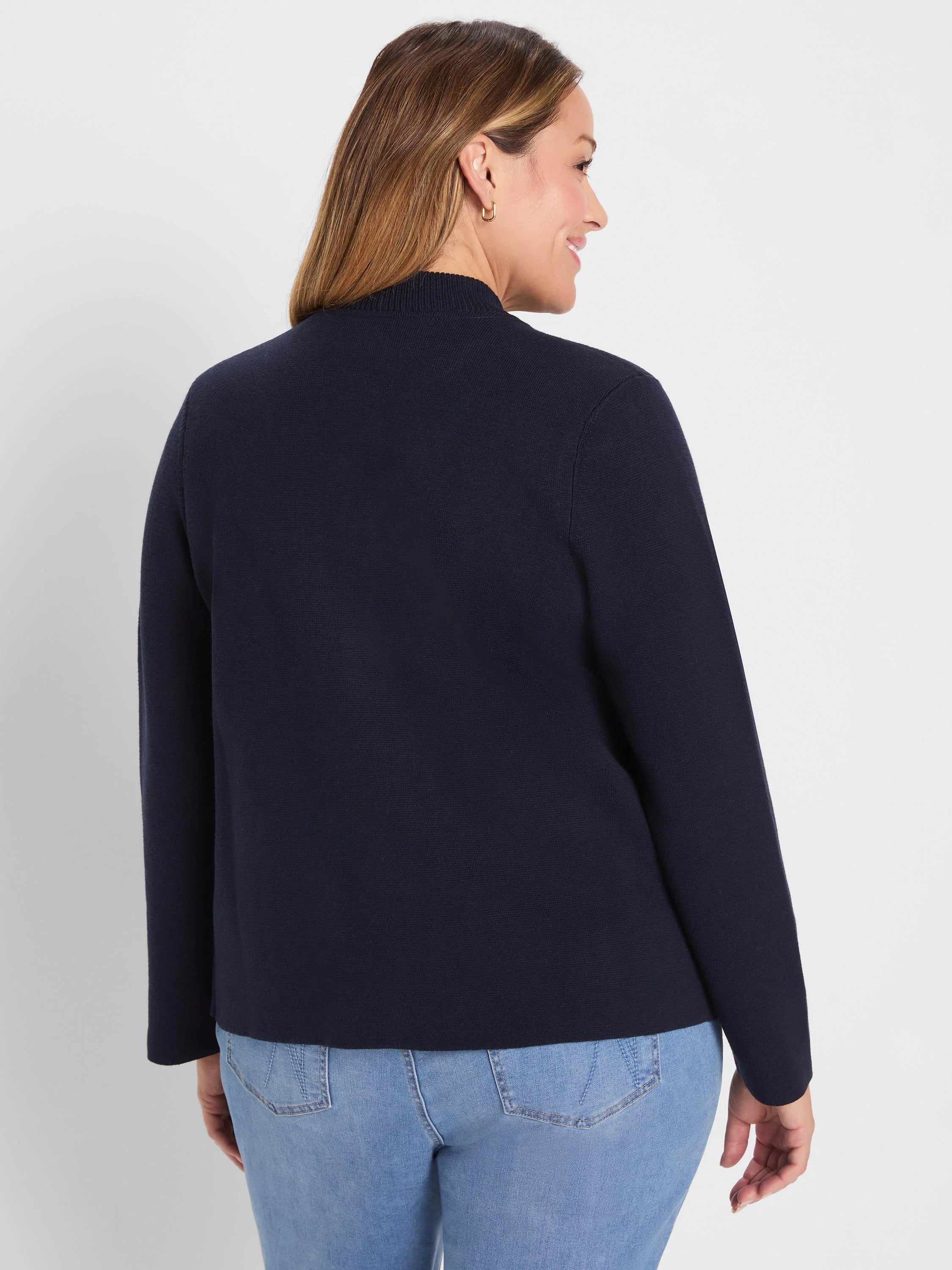 Dark navy fine knit bomber jacket with mock neck, modeled from behind.