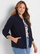 Dark blue knit bomber jacket with ribbed collar, button-front closure, and side pockets.