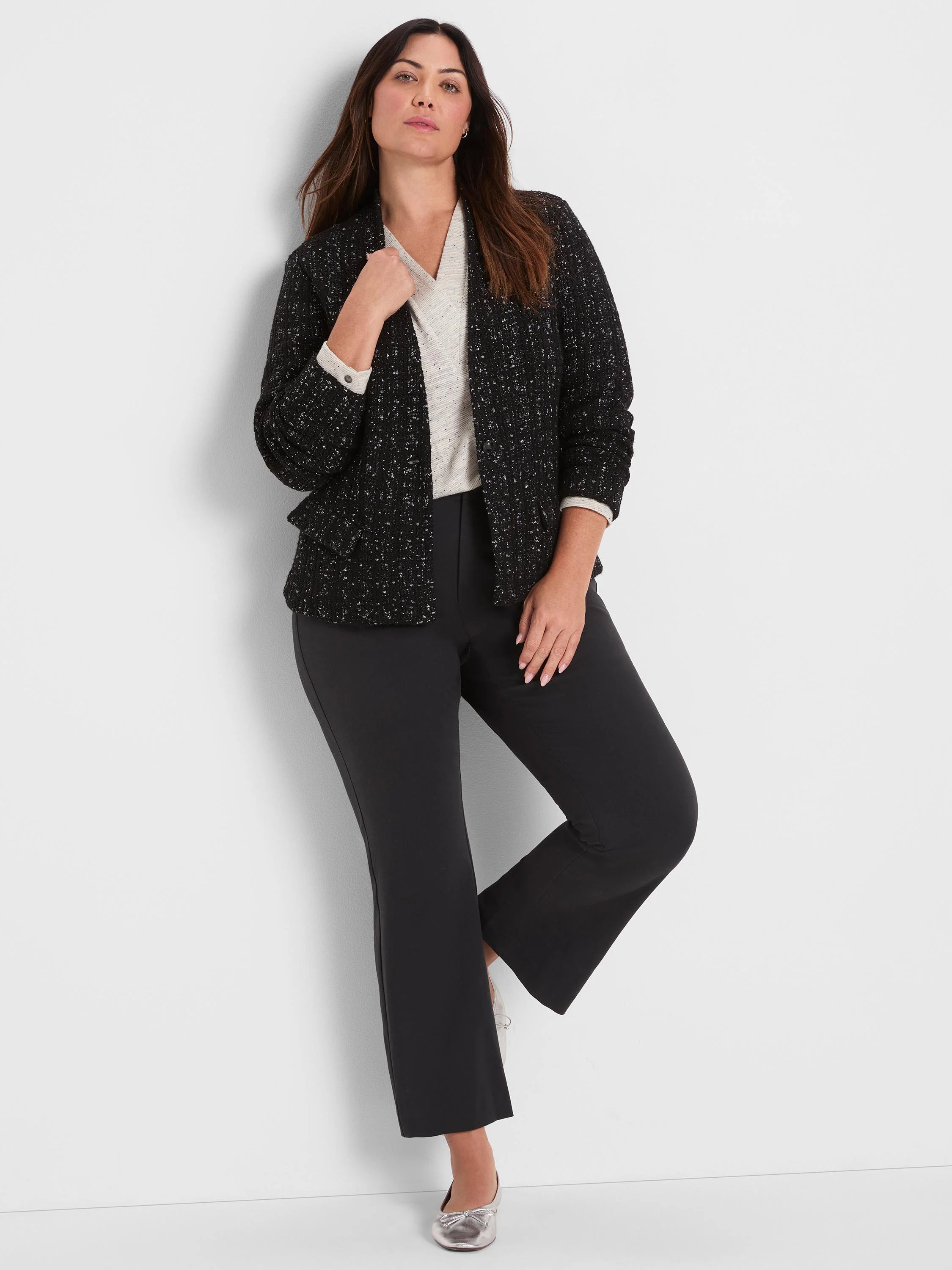 Black knit jacket with metallic silver grid pattern.