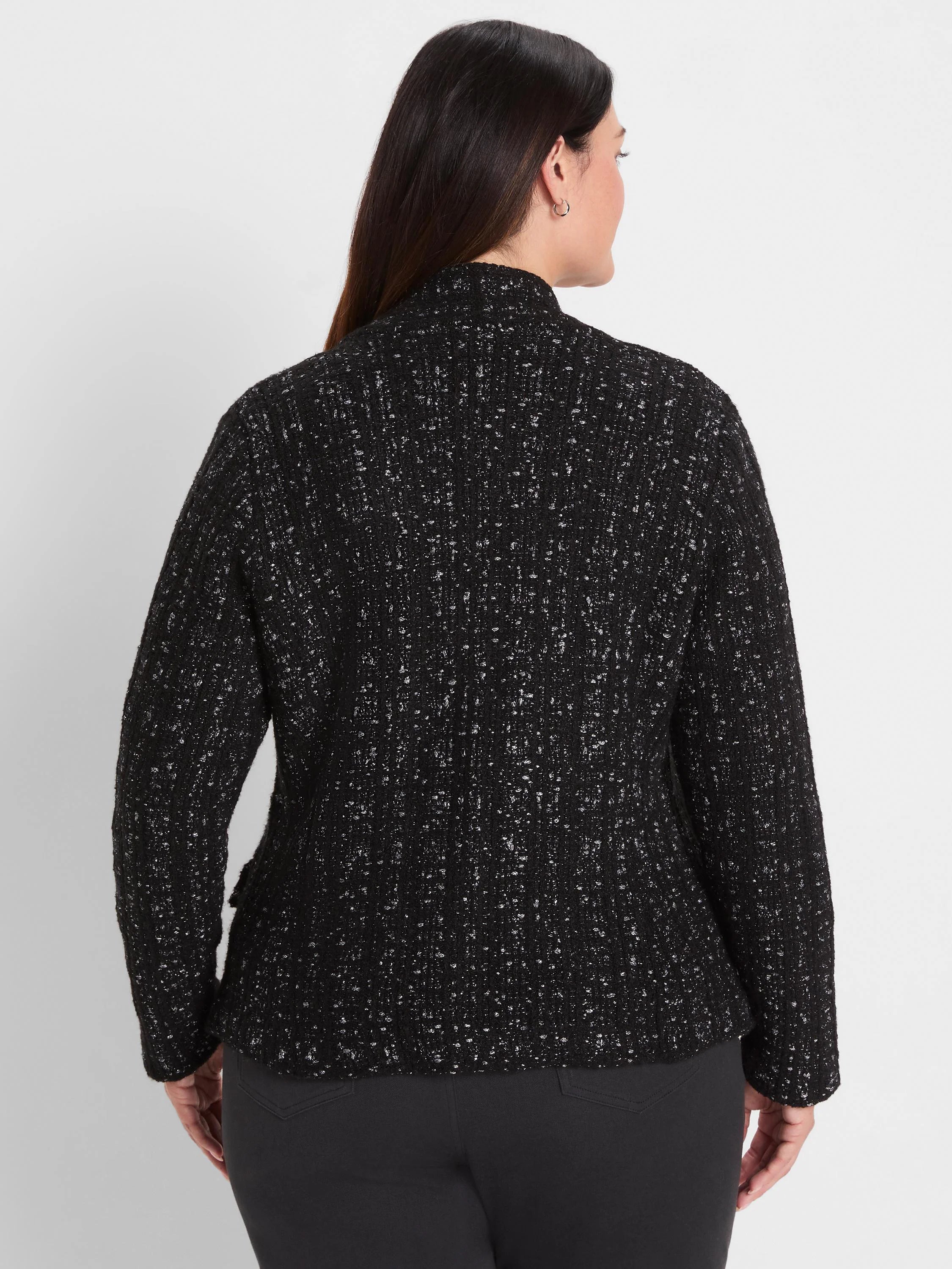 Black knit jacket with silver metallic threads forming a subtle grid pattern, seen from back.