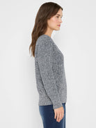 Marled blue and white shaker stitch sweater with long sleeves, ribbed cuffs and hem. Relaxed fit.
