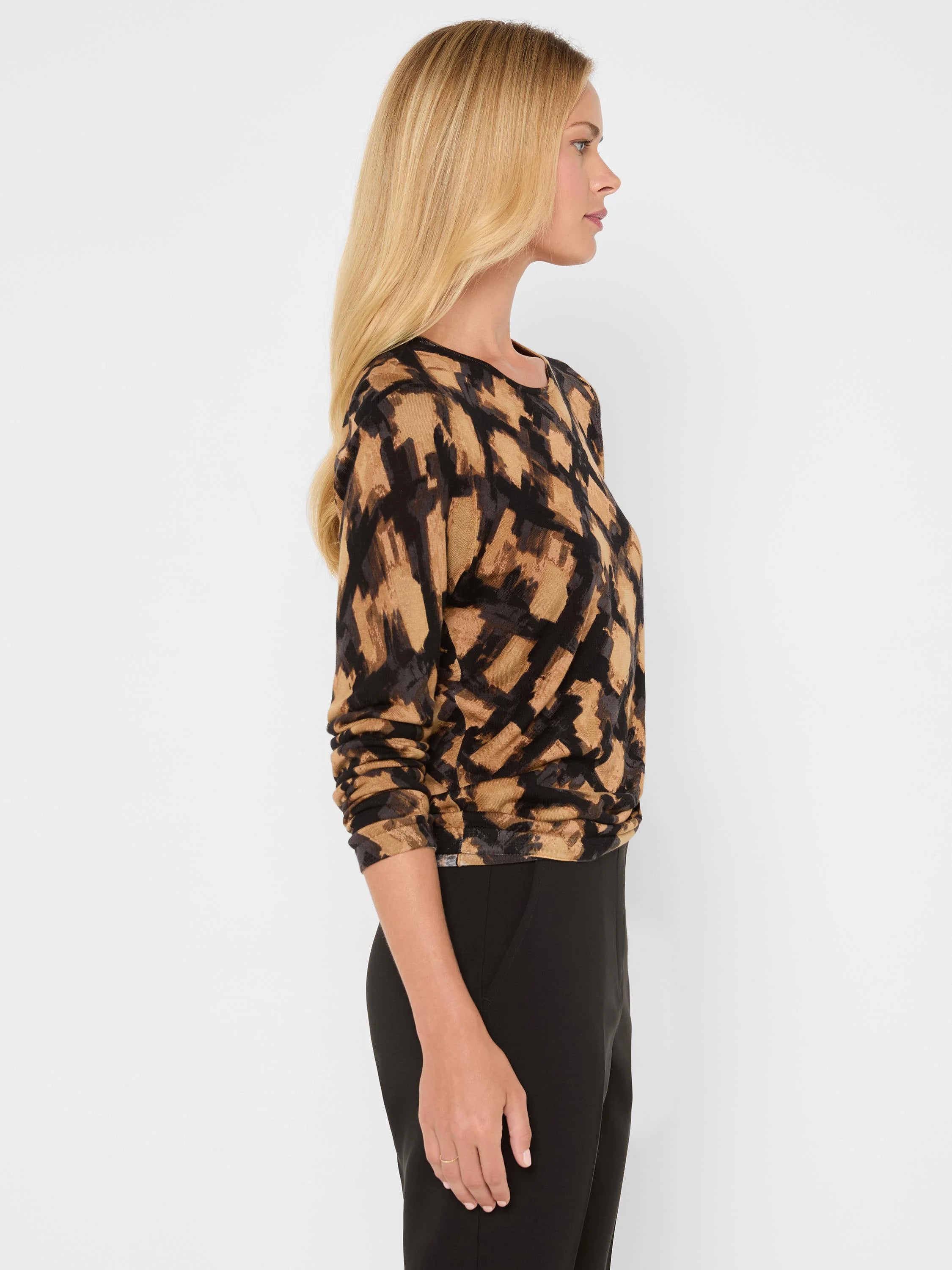 Tan, black, and muted brown/gray sweater with an abstract, irregular check pattern of brushstrokes.