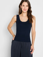 Fitted navy ribbed knit tank with scalloped edges at neckline and armholes.