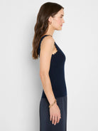 Navy blue ribbed knit tank with scalloped edges at the neckline and armholes.