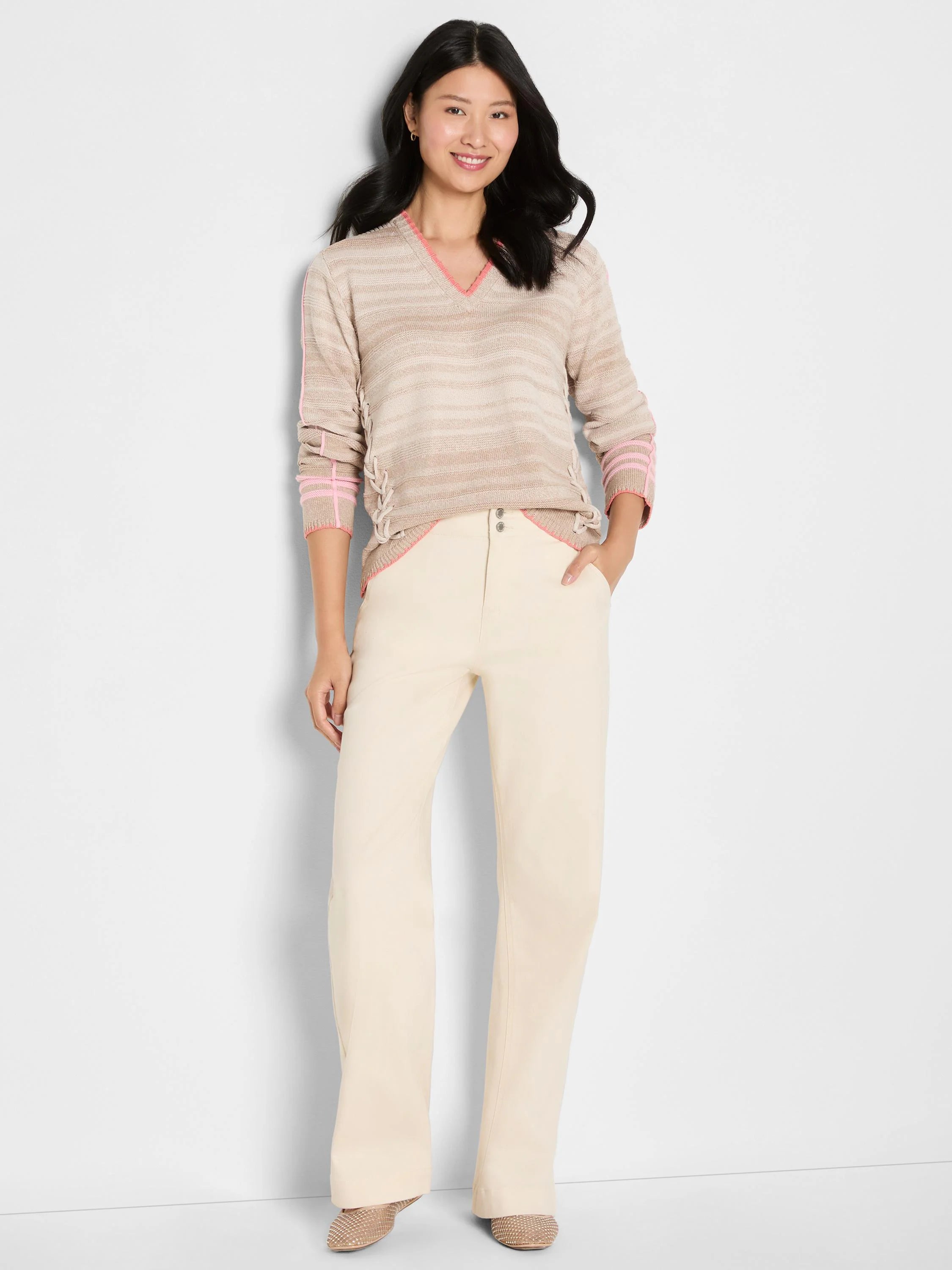 Beige striped V-neck sweater with pink trim on neck, sleeves, hem, and side lace-up details.