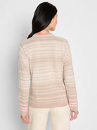 Light beige sweater with textured horizontal stripes. Pink trim on edges, plus pink stripes on sleeves.