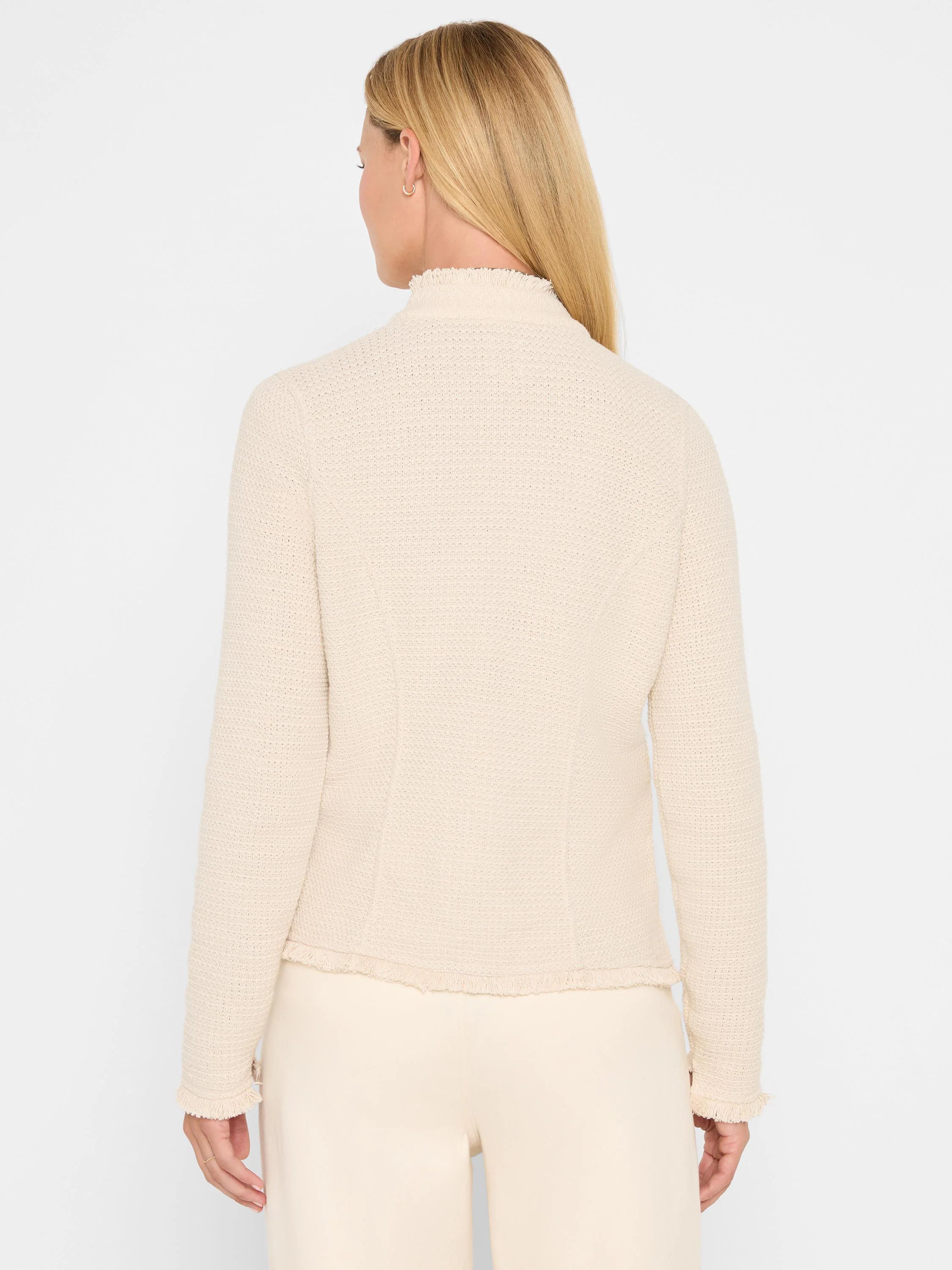 Cream mix knit jacket with a high neck, fringe collar, and fringed hem.