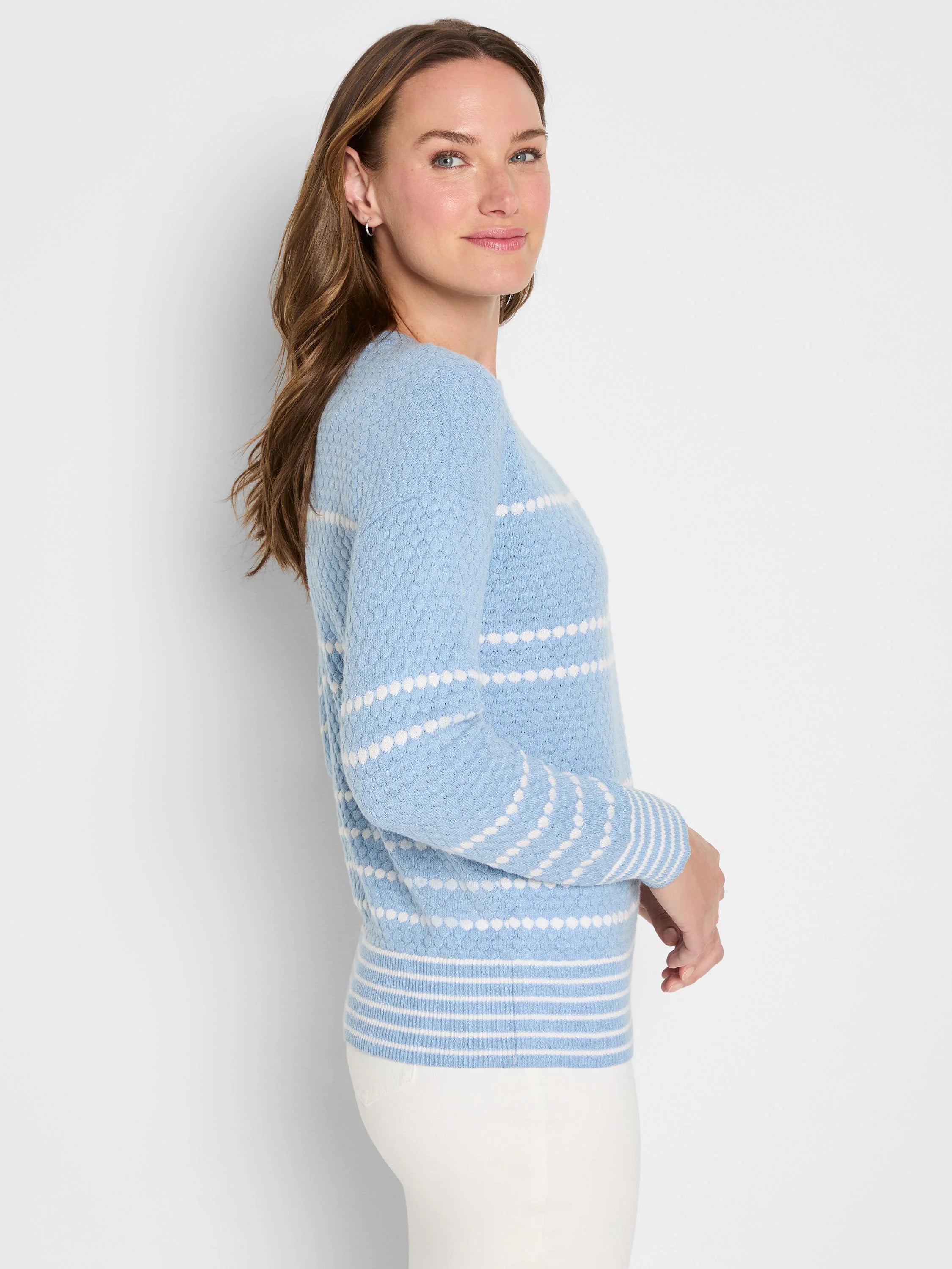 Light blue textured sweater with white horizontal dotted rows and striped cuffs and hem.
