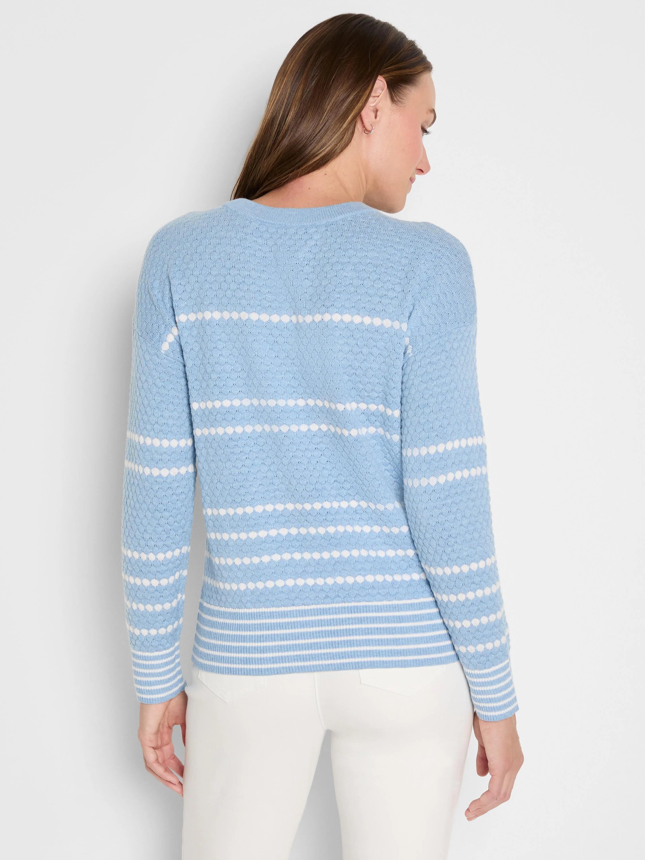 Light blue sweater with white textured horizontal dot stripes; ribbed cuffs & hem have thin white stripes.