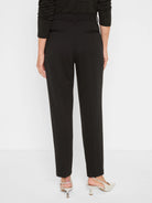 Black trousers, rear view, with straight legs, waistband, belt loops, and two horizontal back welt pockets.