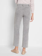 Faded light grey straight knit ankle jeans, seen from behind, with two back pockets and belt loops.