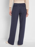 Navy knit wide leg pants with thin white pinstripes, shown from behind. Features rear pockets.