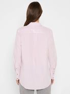 Back view: Light pink long-sleeve shirt with thin vertical stripes and subtle scattered sequins on the upper back.