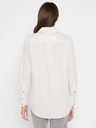 Off-white long-sleeve shirt with thin grey vertical stripes. Back yoke features horizontal shimmering stripes. Buttoned...