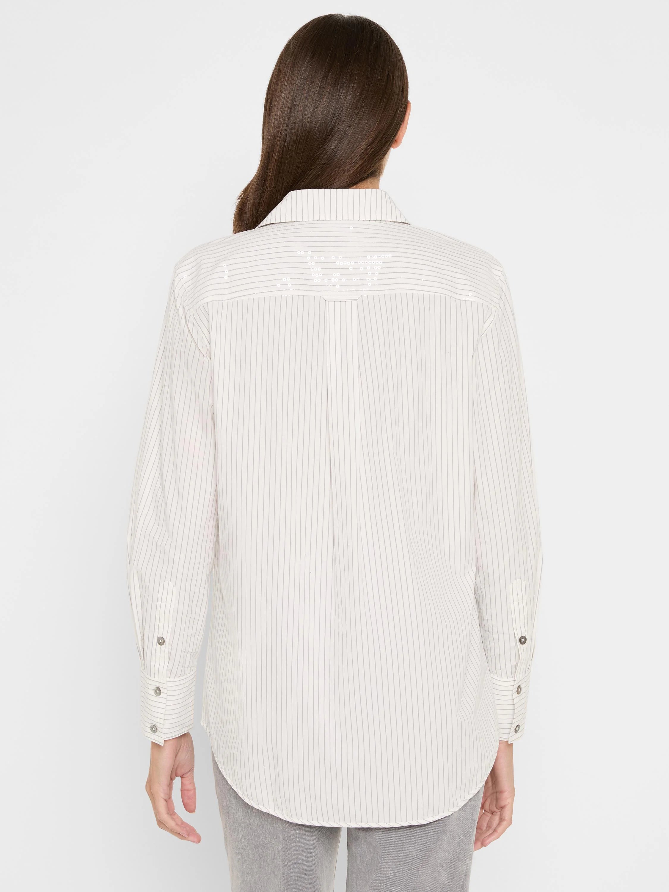 Off-white long-sleeve shirt with thin grey vertical stripes. Back yoke features horizontal shimmering stripes. Buttoned...