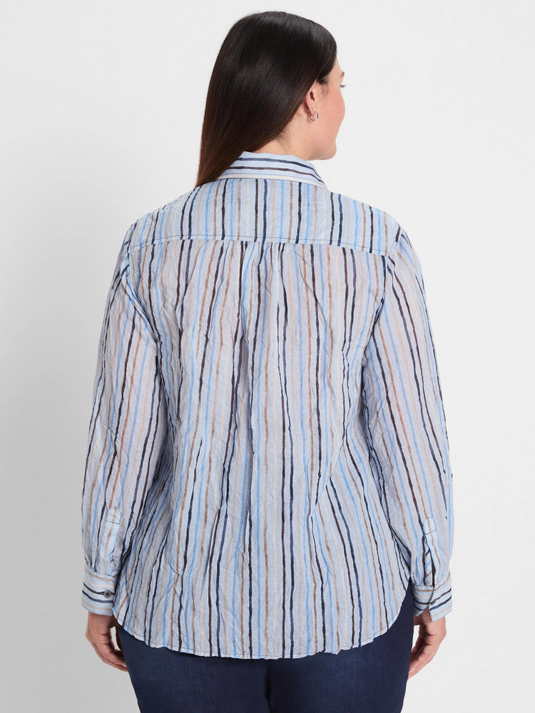 Light blue crinkled shirt with irregular vertical stripes in shades of blue, brown, and black.