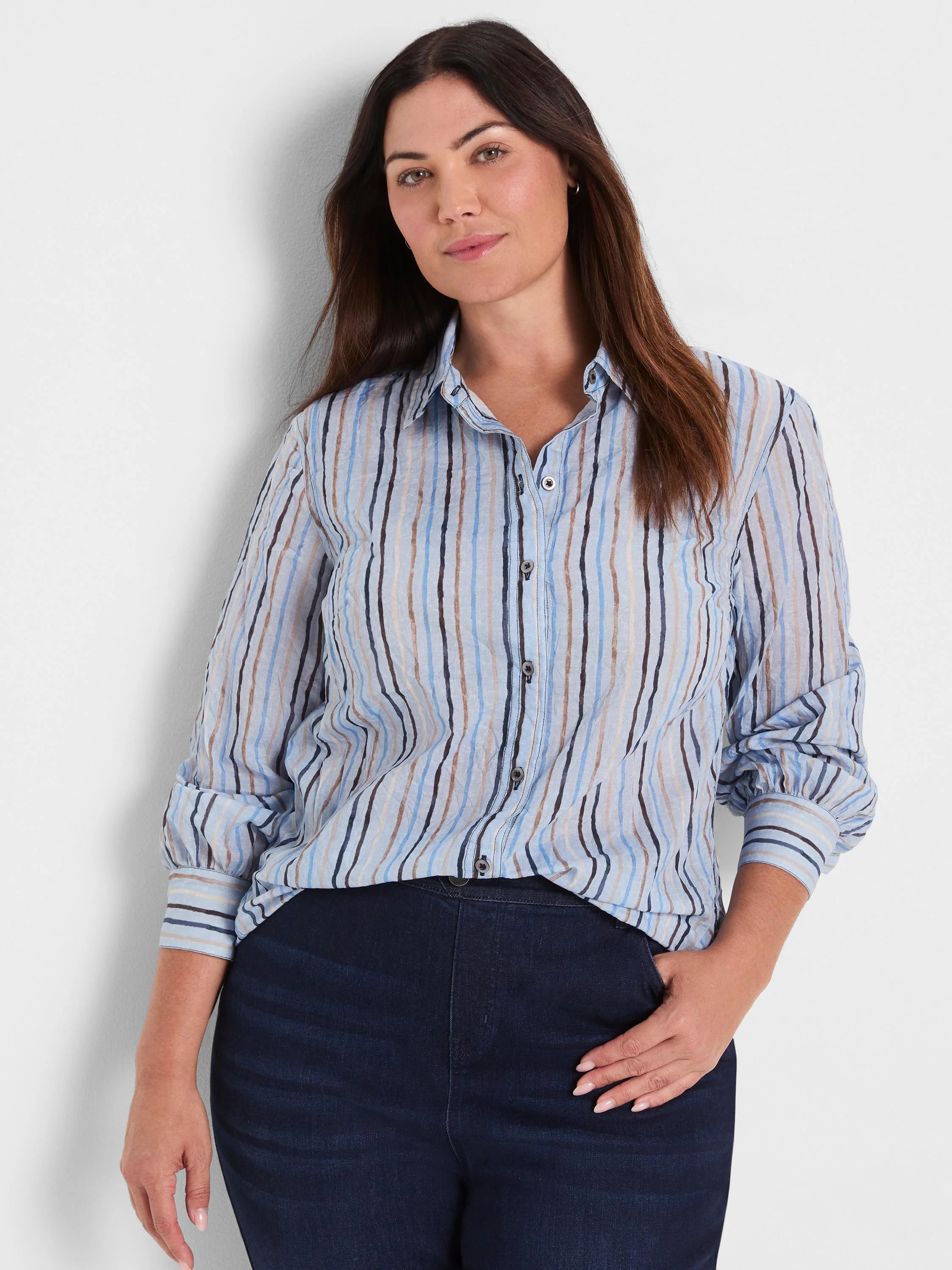 Light blue cotton shirt with painted vertical stripes in shades of blue, tan, and cream.