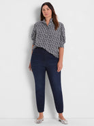 Navy blue button-up shirt with white etched heart pattern and puffed short sleeves.