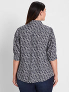 Dark blue shirt with white etched hearts pattern, shown from the back. Has 3/4 sleeves with gathered cuffs.