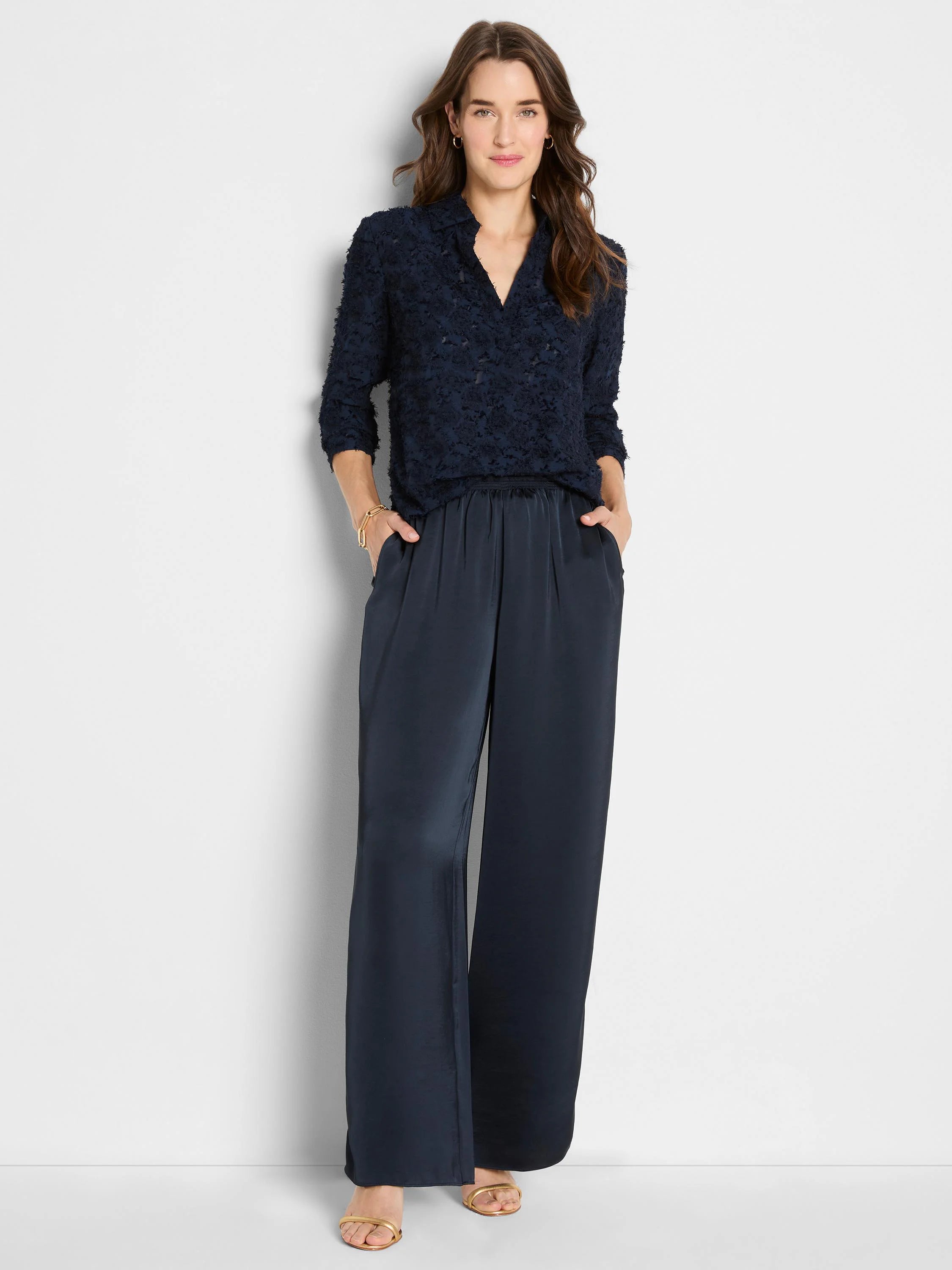 Deep navy blue clipped jacquard top with V-neck, collar, and 3/4 sleeves.