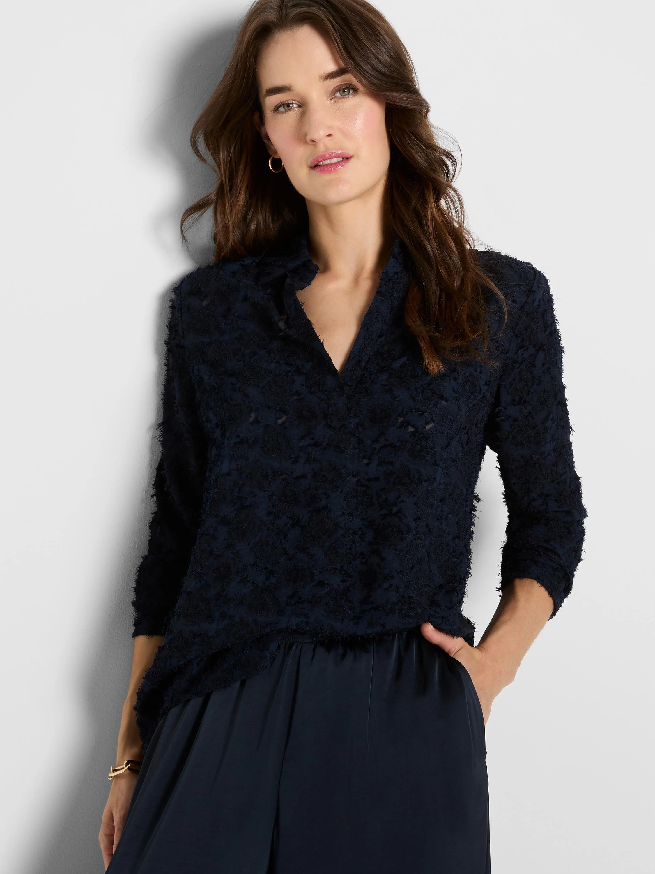 Navy blue V-neck top with a textured, raised clipped jacquard fabric and 3/4 sleeves.