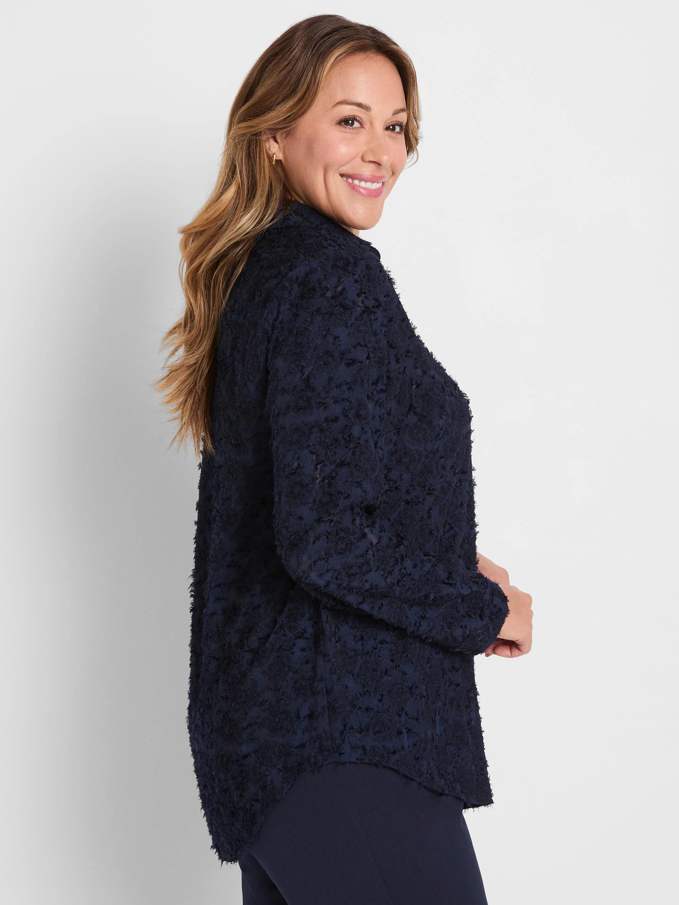 Dark navy top with a textured, fuzzy clipped jacquard pattern.
