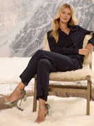 Navy clipped jacquard top with a V-neck and long sleeves.