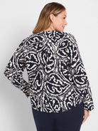Dark indigo long-sleeved top with an off-white abstract organic pattern.
