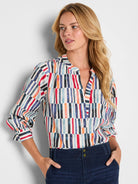 Cream cotton top with broken vertical stripes in red, navy, light blue, orange, black. V-neck, blouson long sleeves.