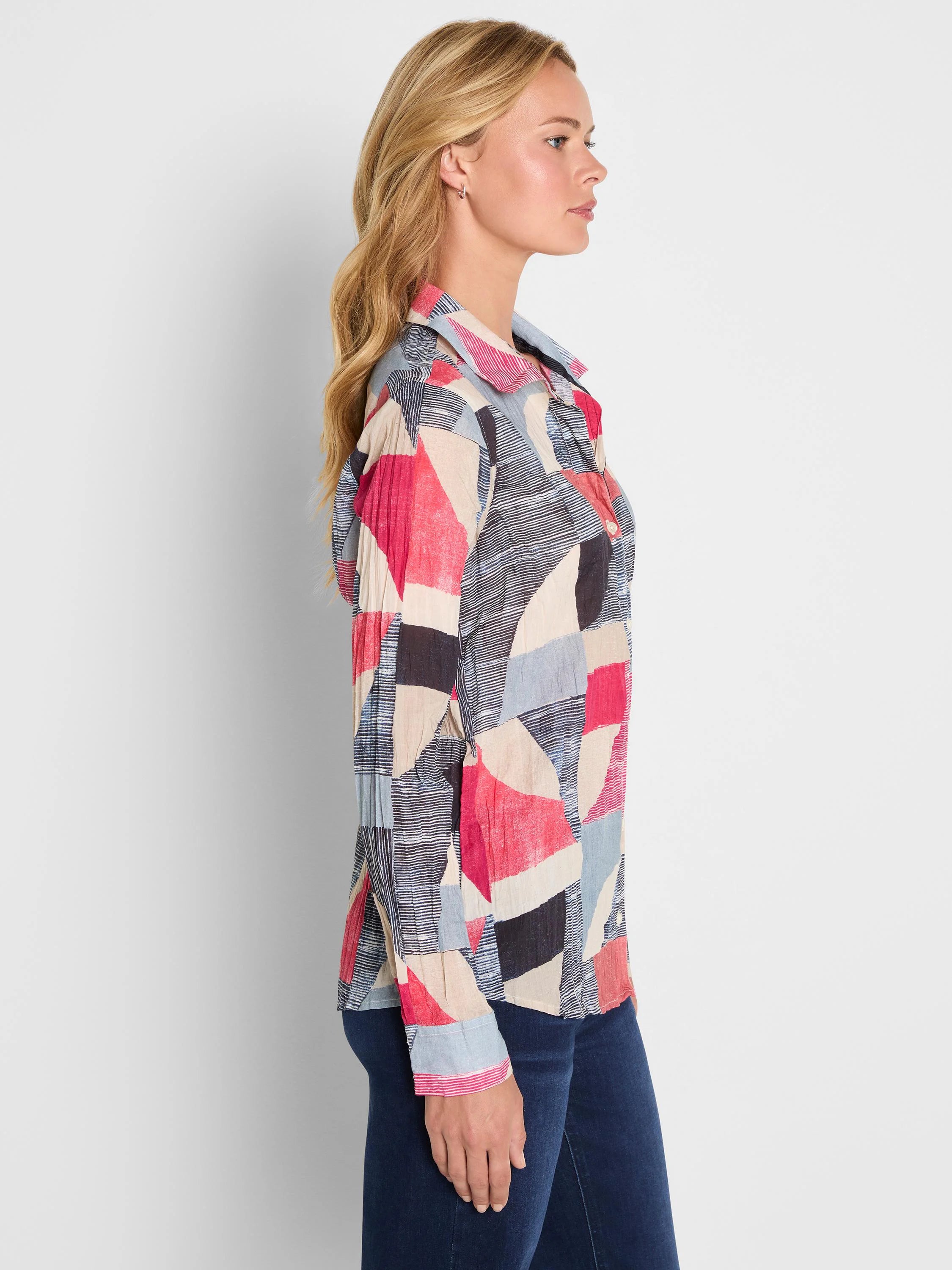 Crinkle shirt with abstract geometric pattern in red, light blue, black, beige, and white stripes. Collared, long sleeves.
