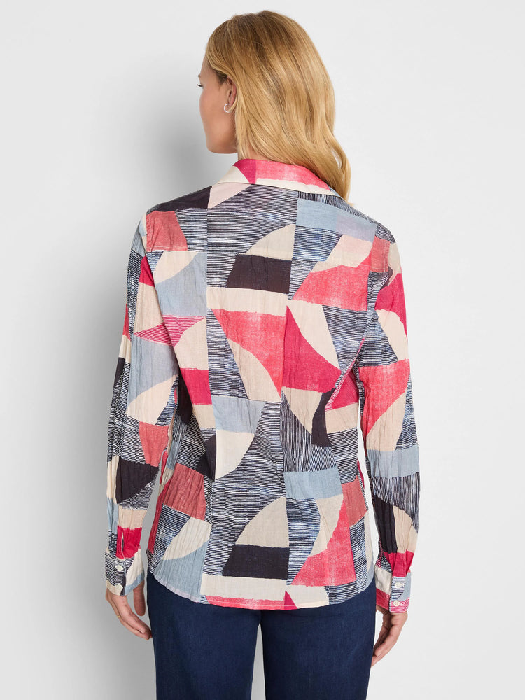 Crinkled cotton shirt with abstract geometric pattern in red, blue, black, and beige, featuring striped sections.