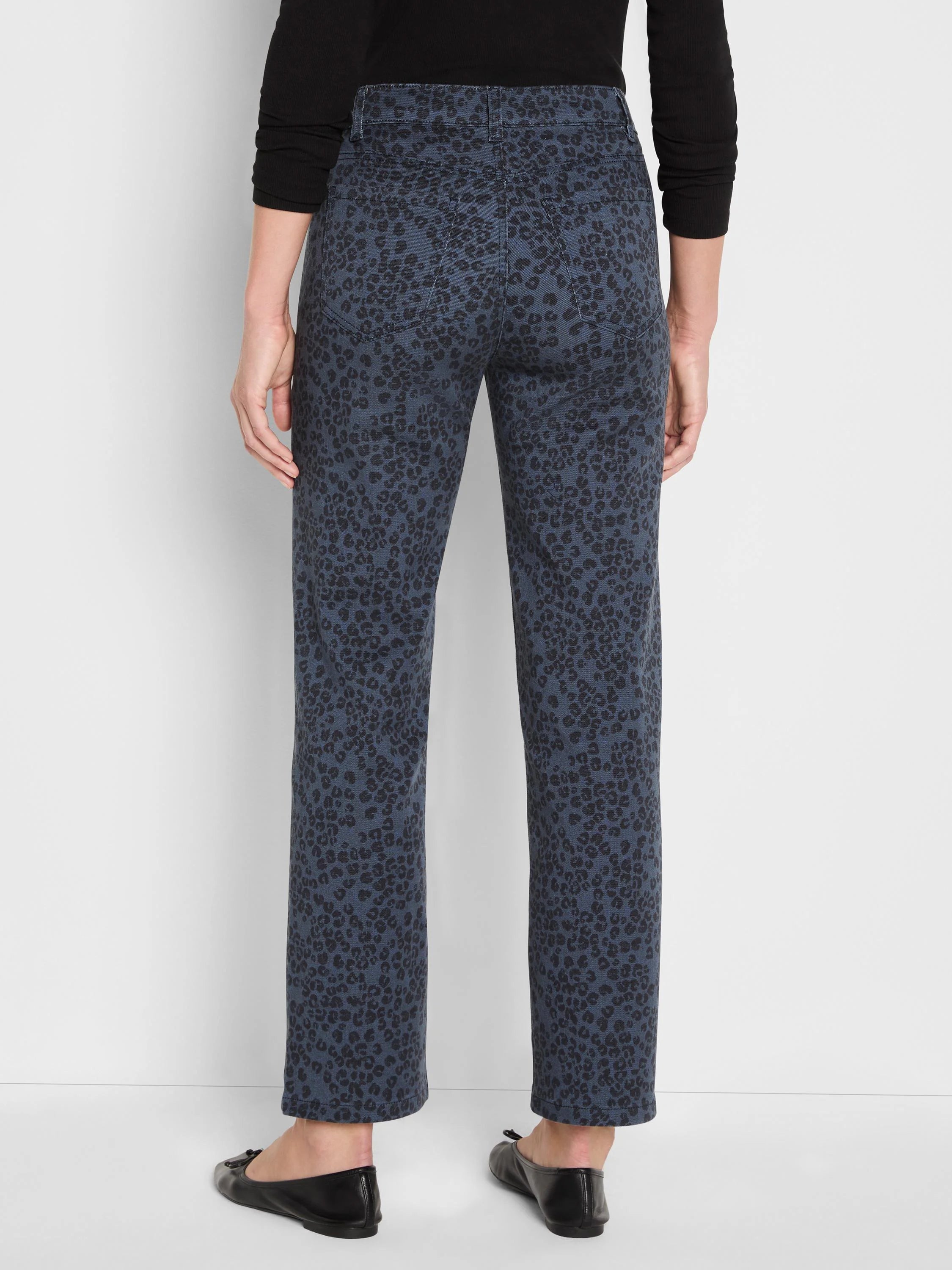 Dark blue straight ankle jeans with black leopard print. Back view, high waist.